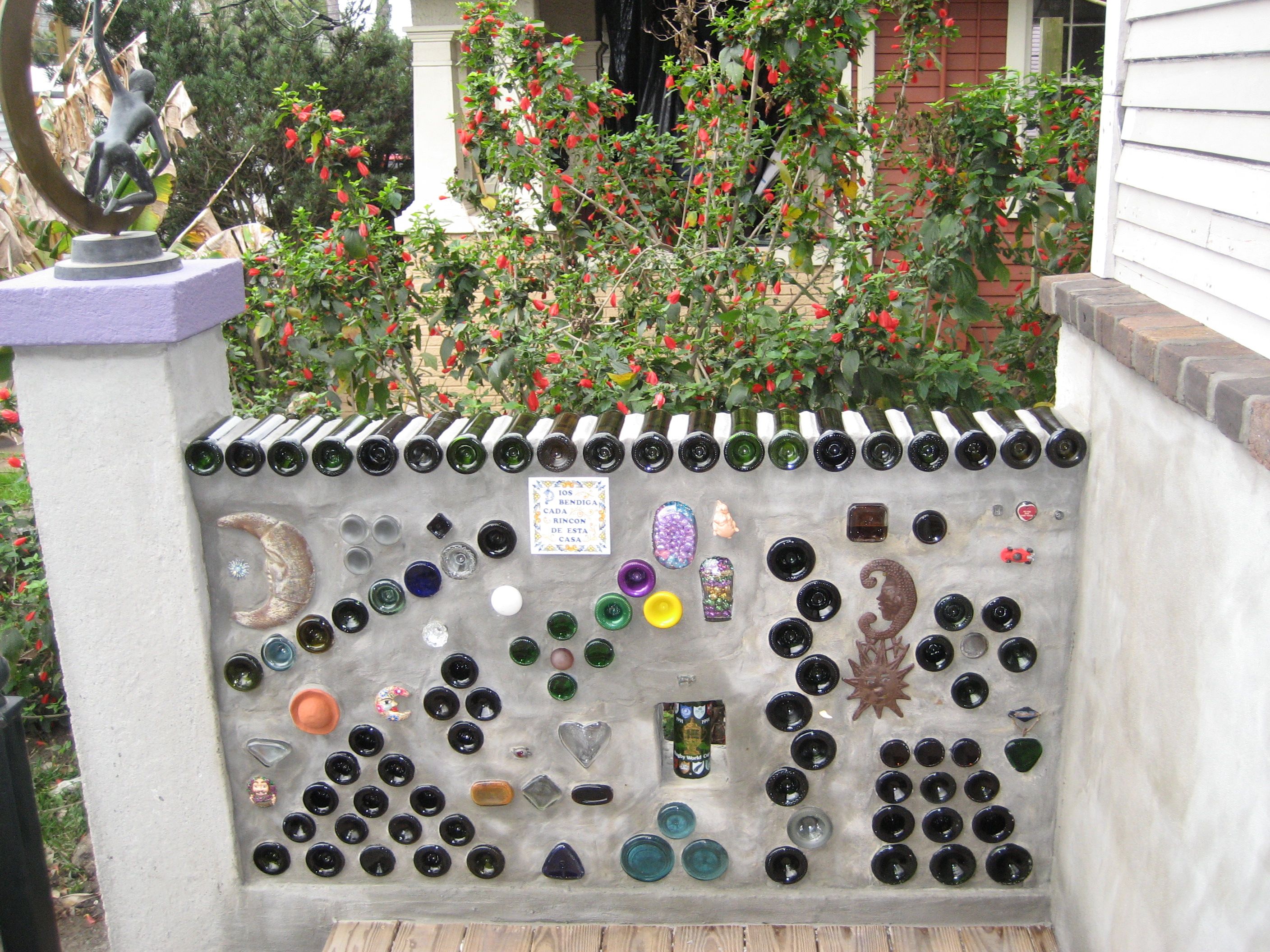 Custom outdoor stone memory wall with set-in keepsakes