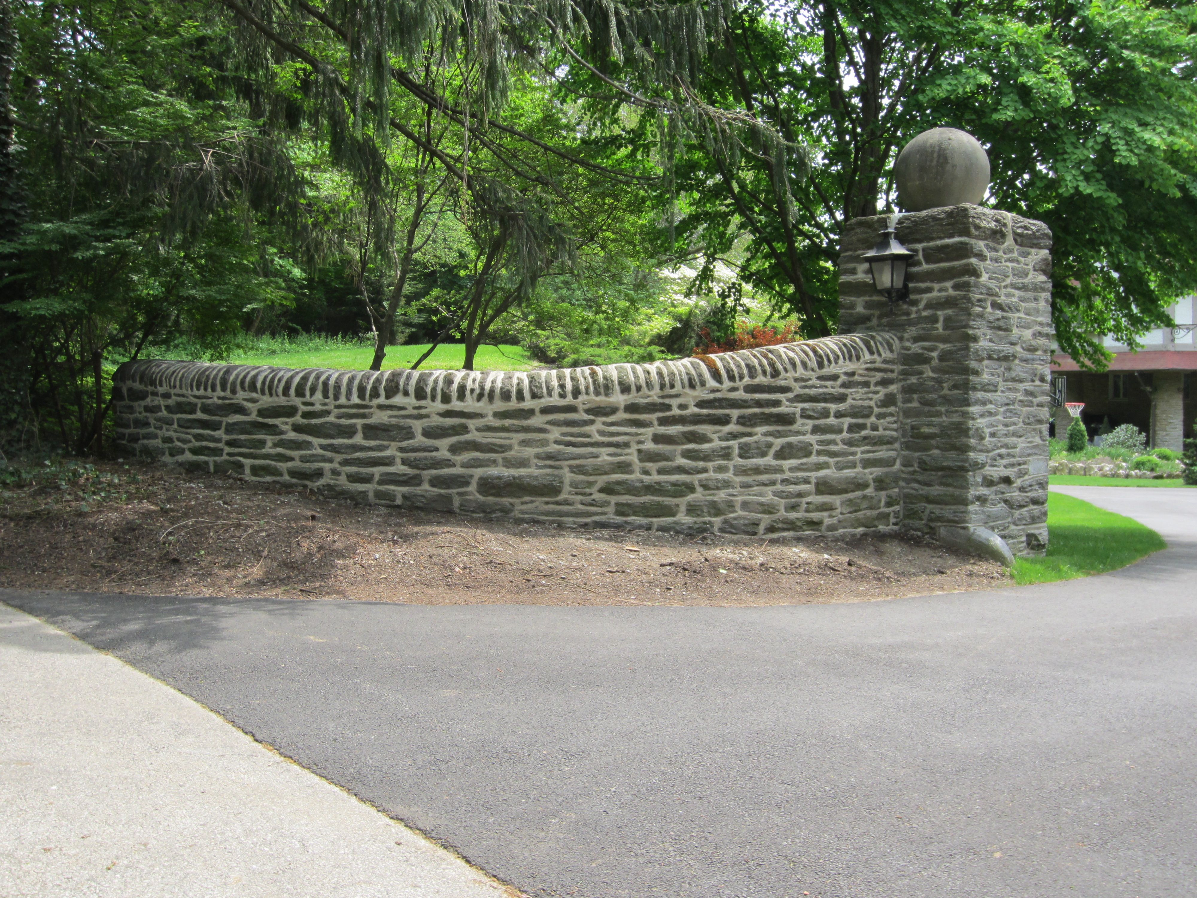 Custom stone entrance with steps and stone piers