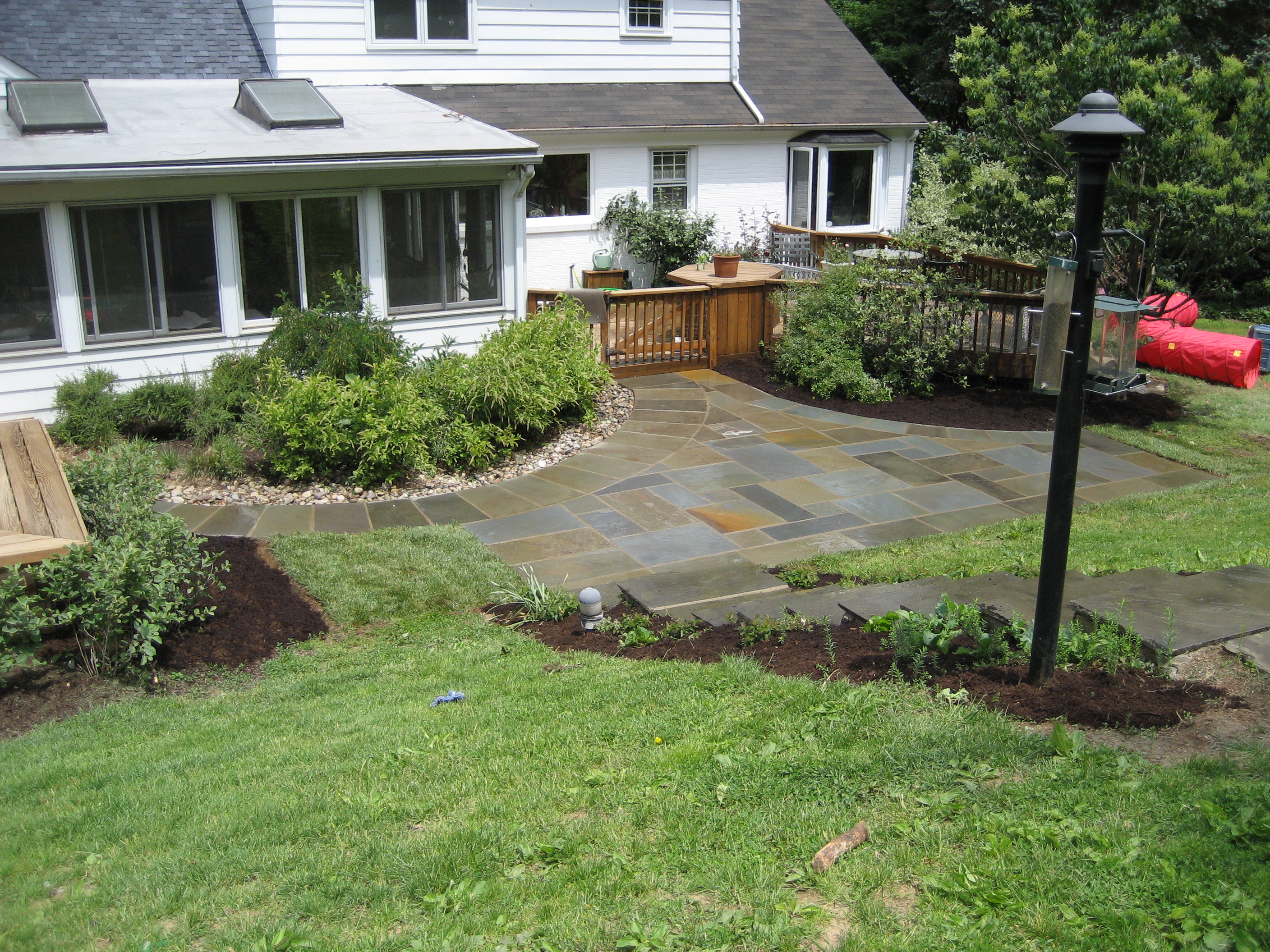 Irregular flagstone patio with stone border